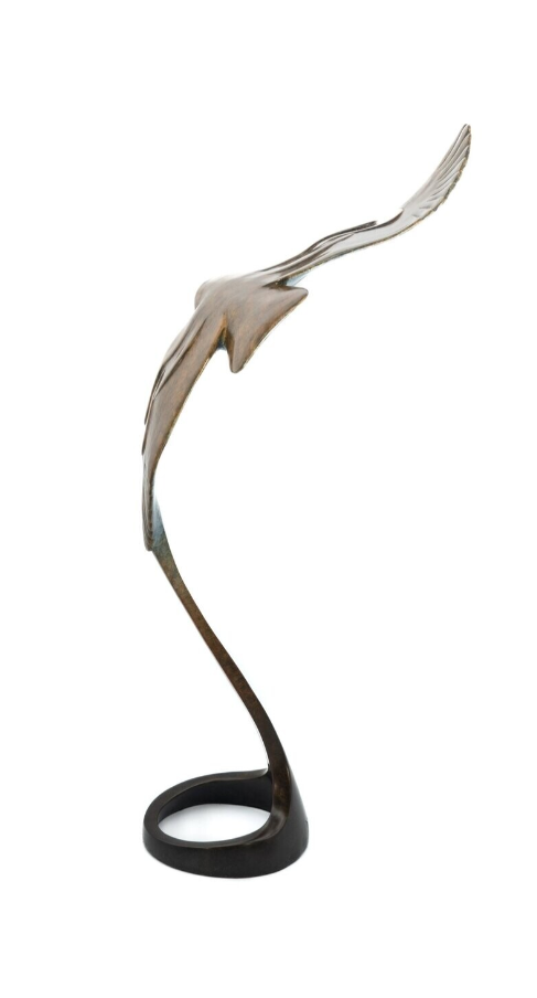 Metallic bird sculpture on a white background