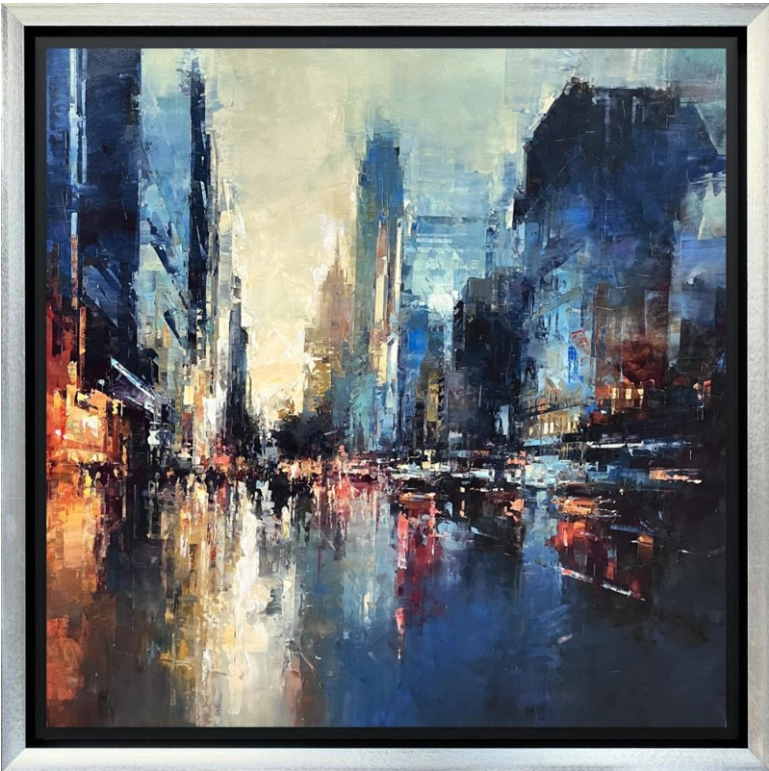 Framed painting of new york city street scene with tall buildings and reflective wet road.