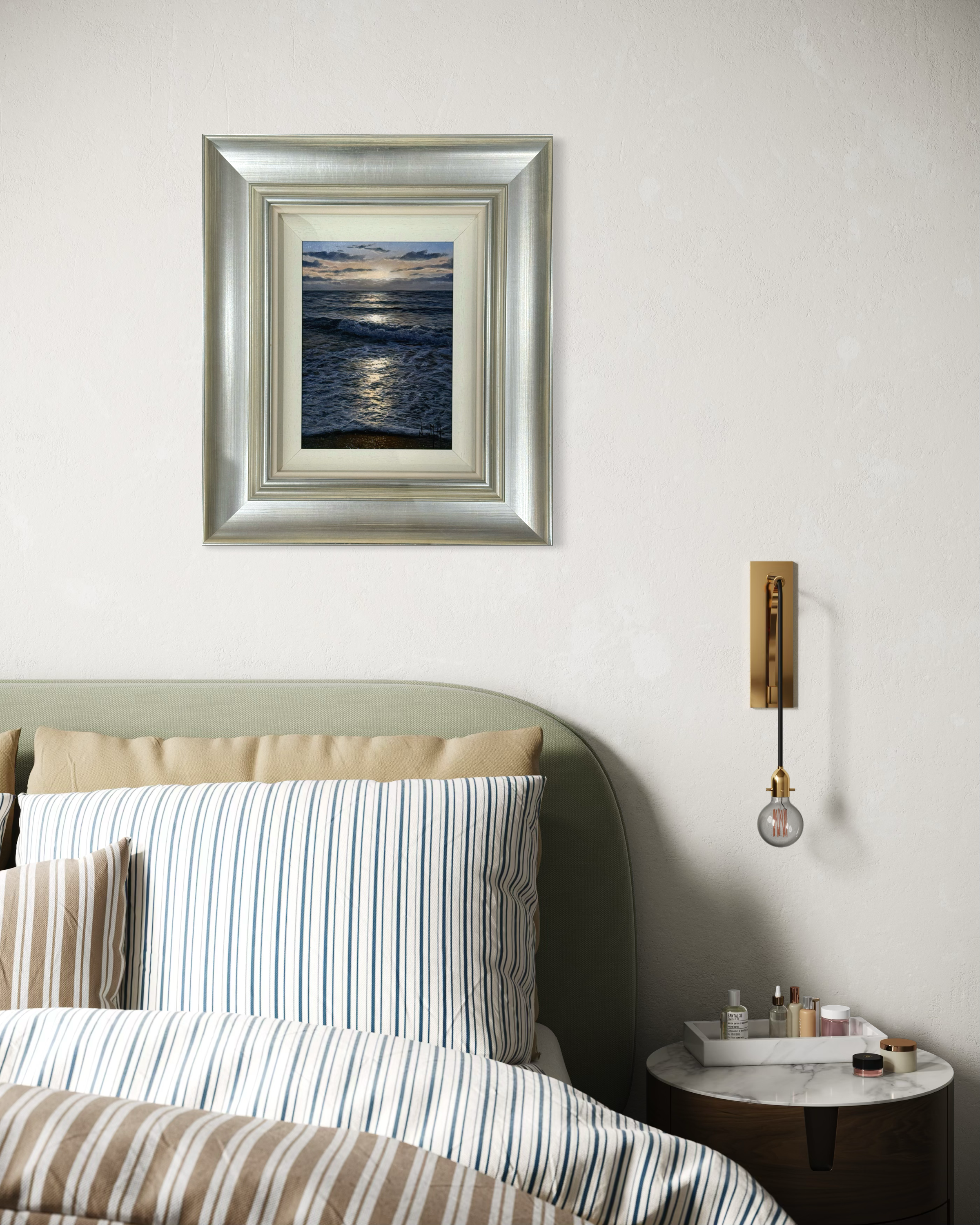 Framed seascape artwork by alfredo navarro  above a bed in a bedroom setting