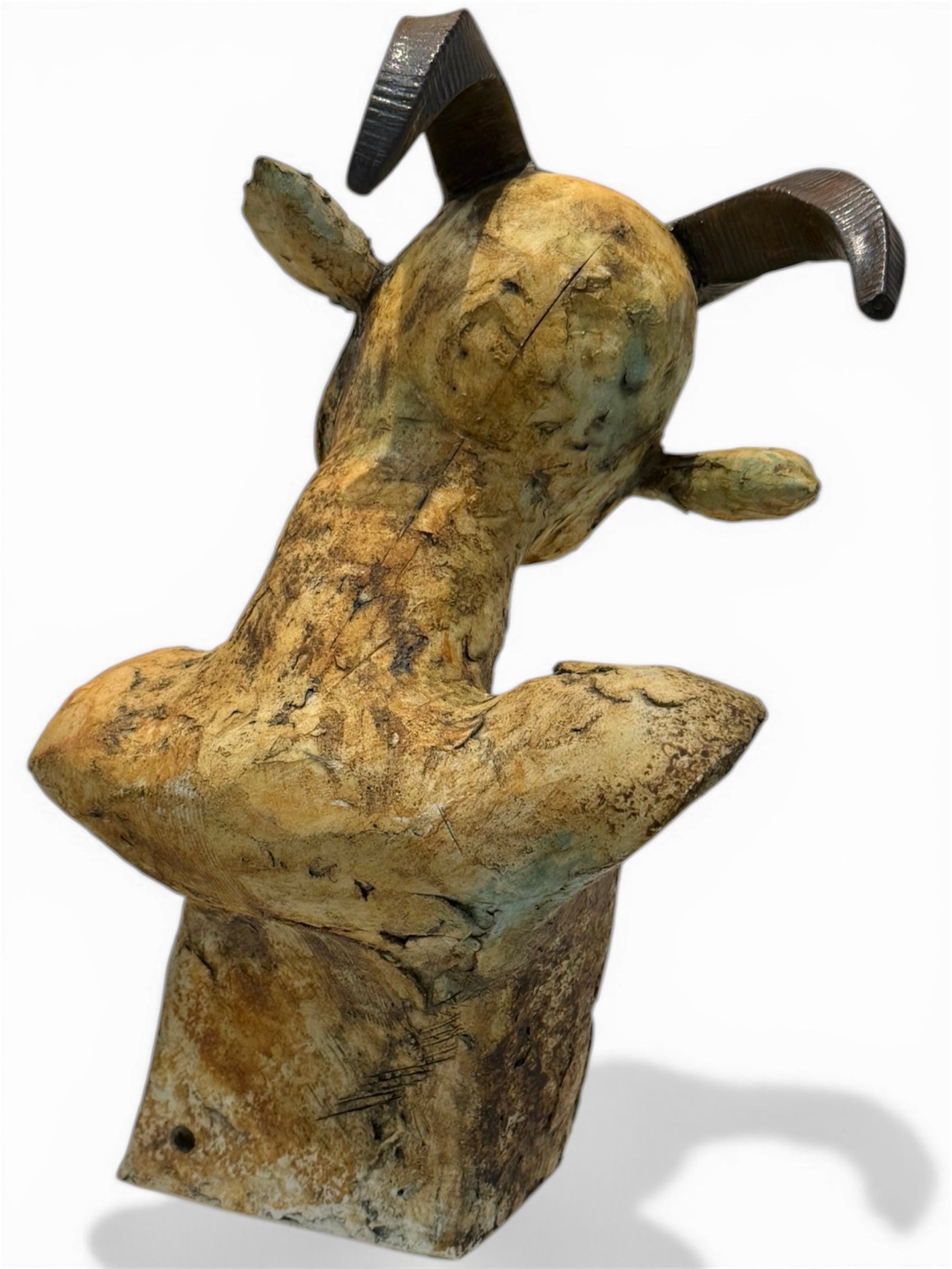 Abstract sculpture with a textured surface on a white background