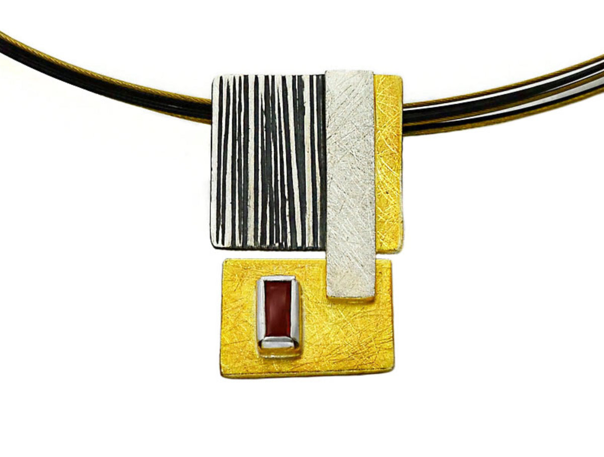 Necklace with a rectangular pendant featuring black, white, and yellow colors on a white background.