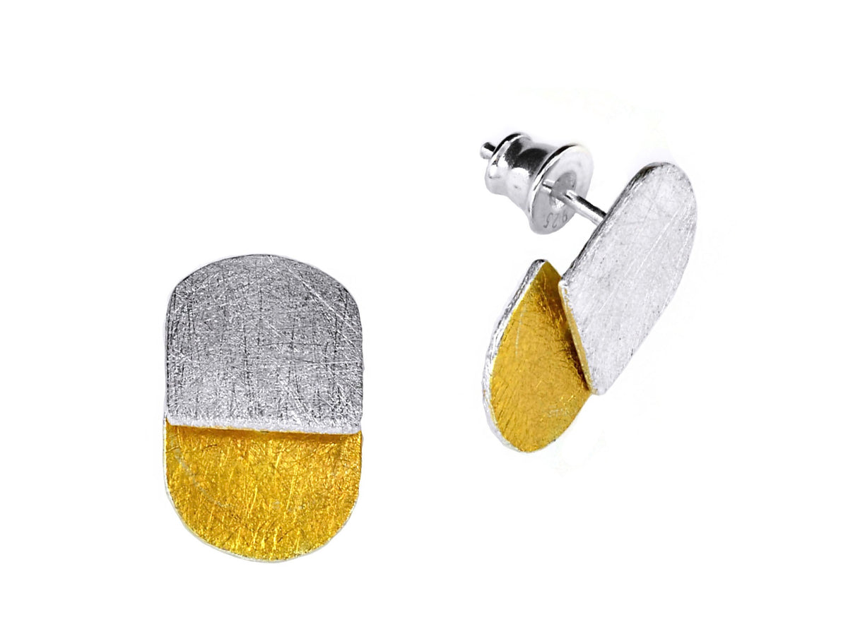 Pair of earrings with gold and silver finish on a white background