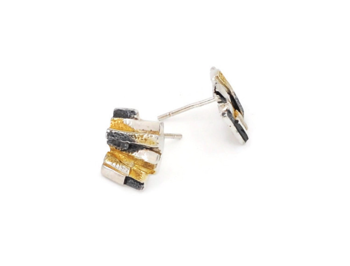 Pair of earrings with stacked rectangular stones on a white background