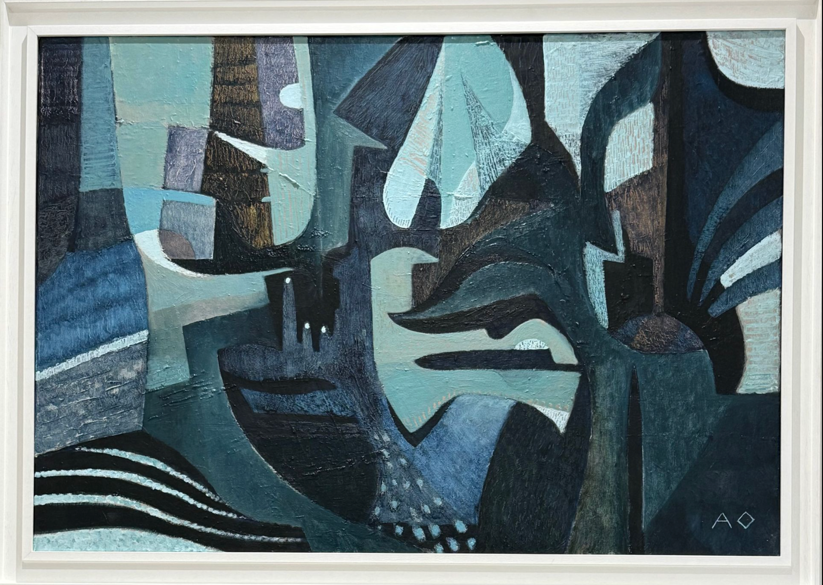 Abstract artwork with geometric shapes in blue, black, and white in a white frame
