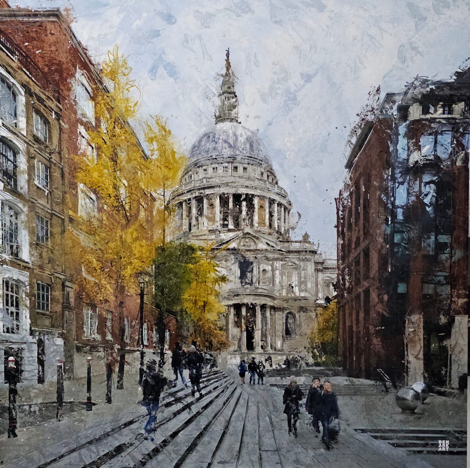 St Pauls Cathederal London in background viewed down a street with a tree with golden leaves 