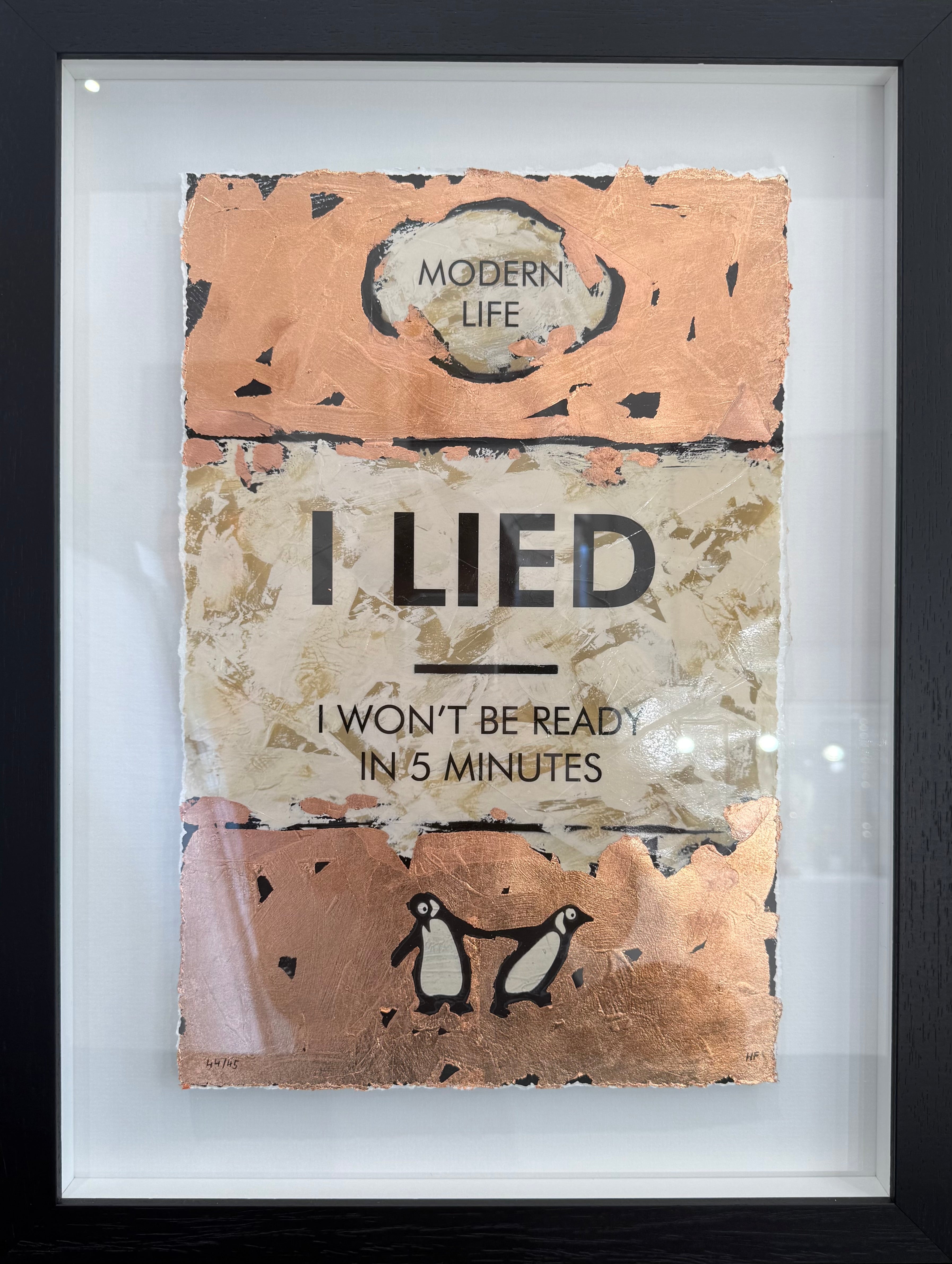 Framed artwork with text 'I LIED I WON'T BE READY IN 5 MINUTES' and a penguin illustration.