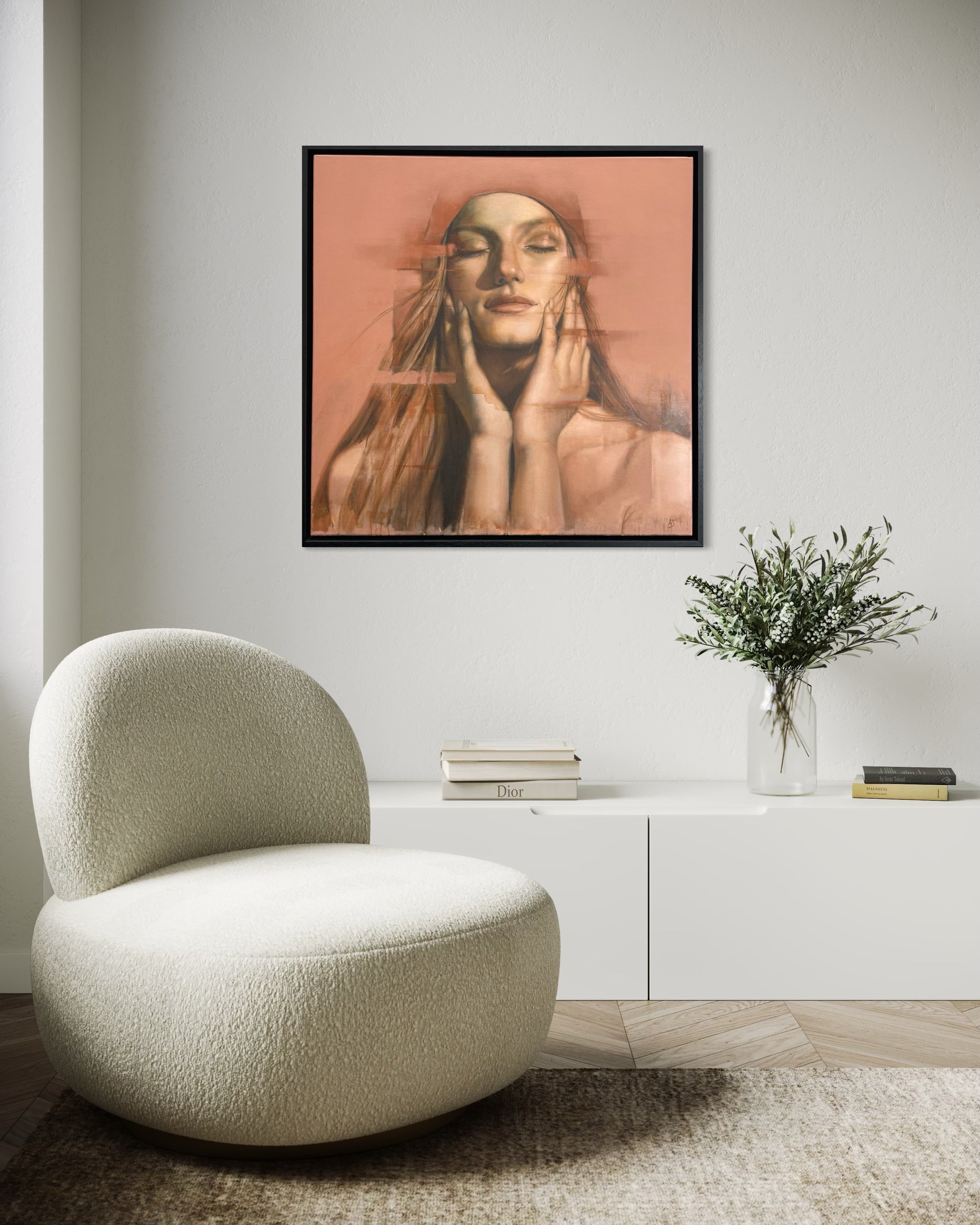 Modern interior with a textured chair, white cabinet, and framed artwork of a woman.