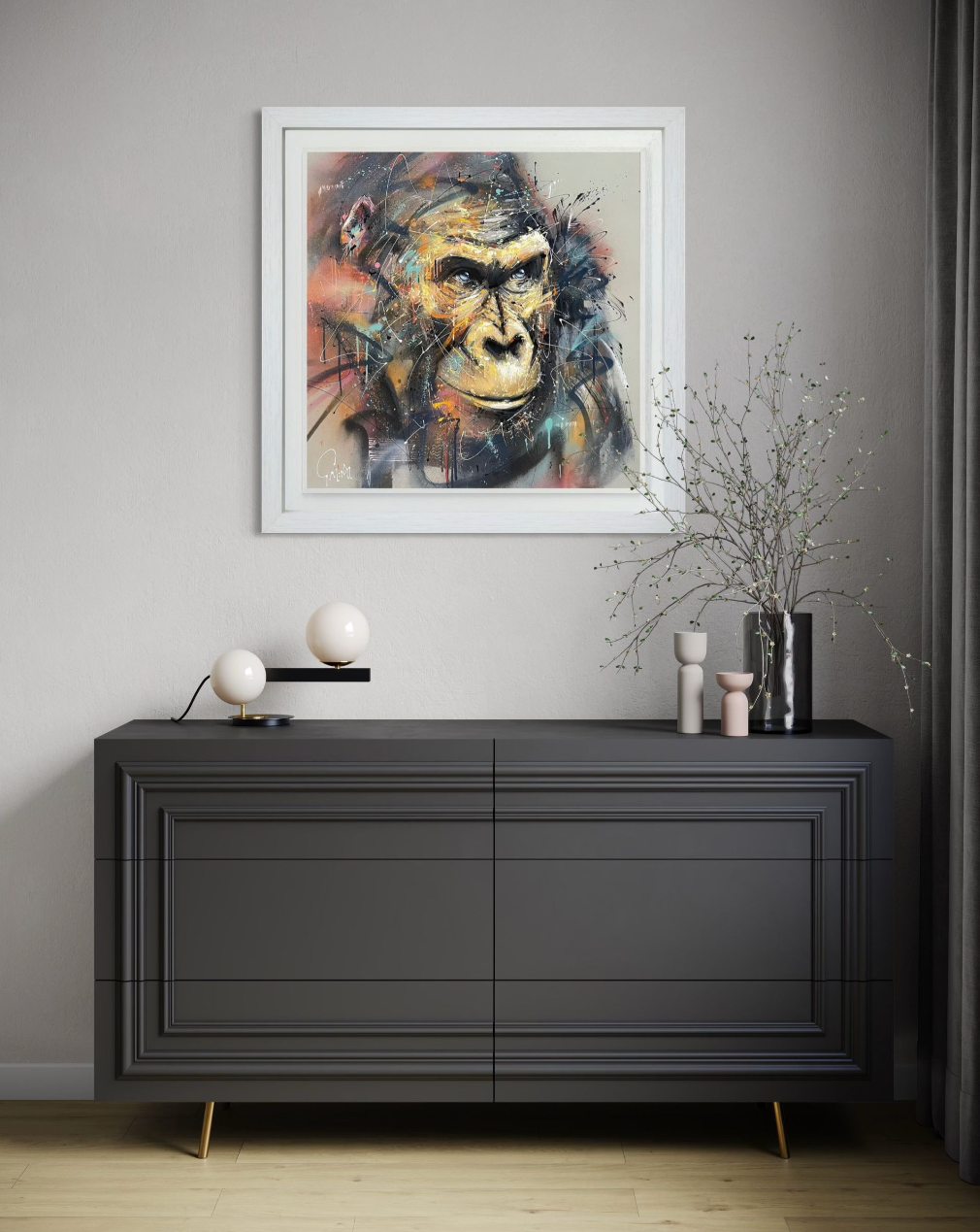 Modern interior with a black dresser and abstract painting of a gorilla on the wall.