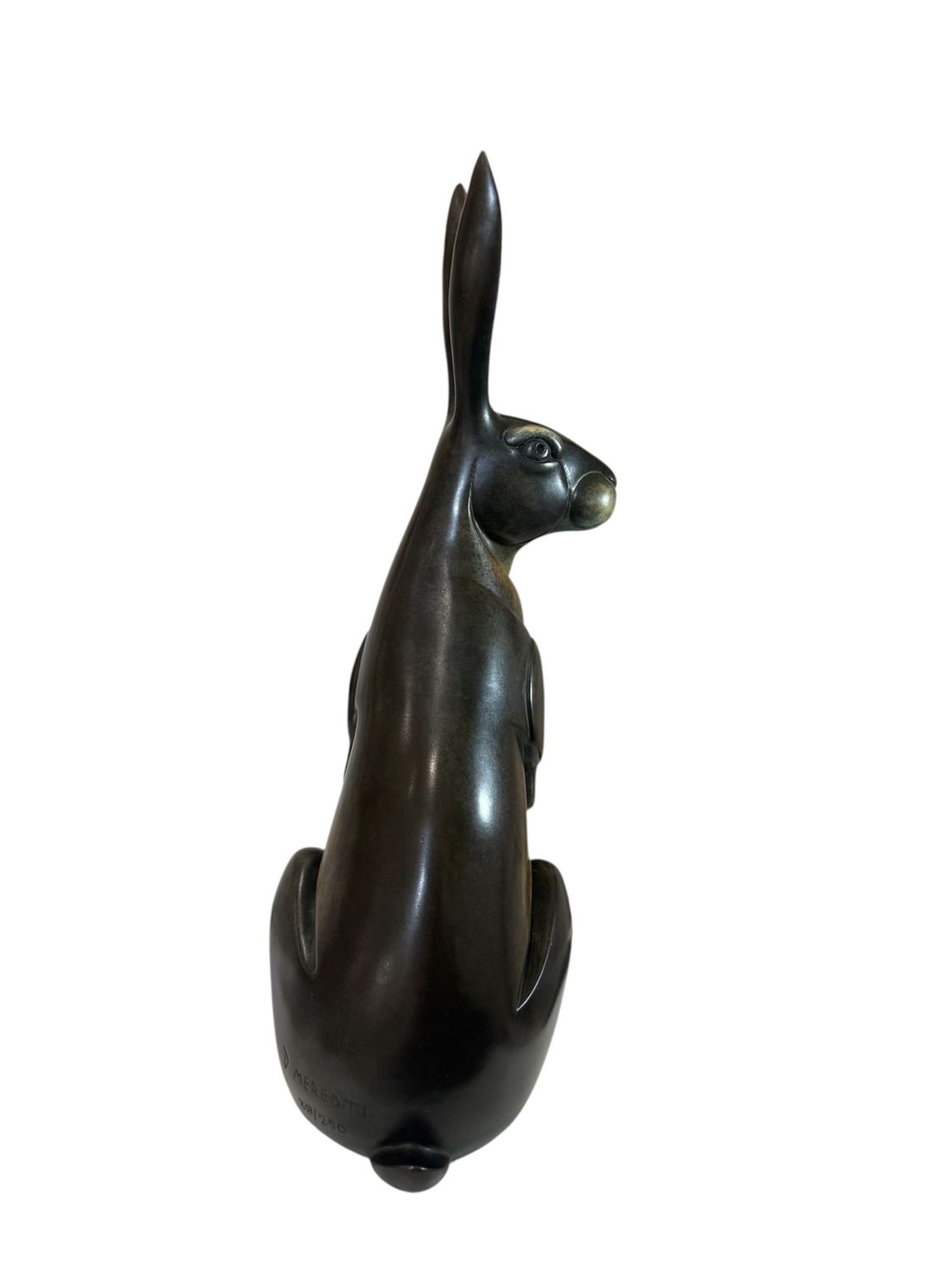 Bronze sculpture of a rabbit on a white background
