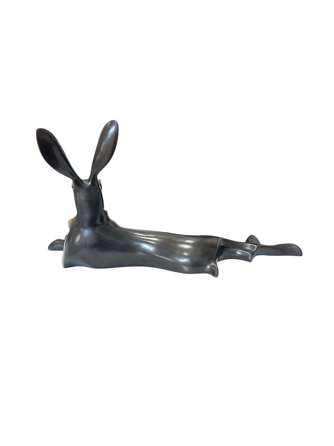 Bronze sculpture of a rabbit on a white background