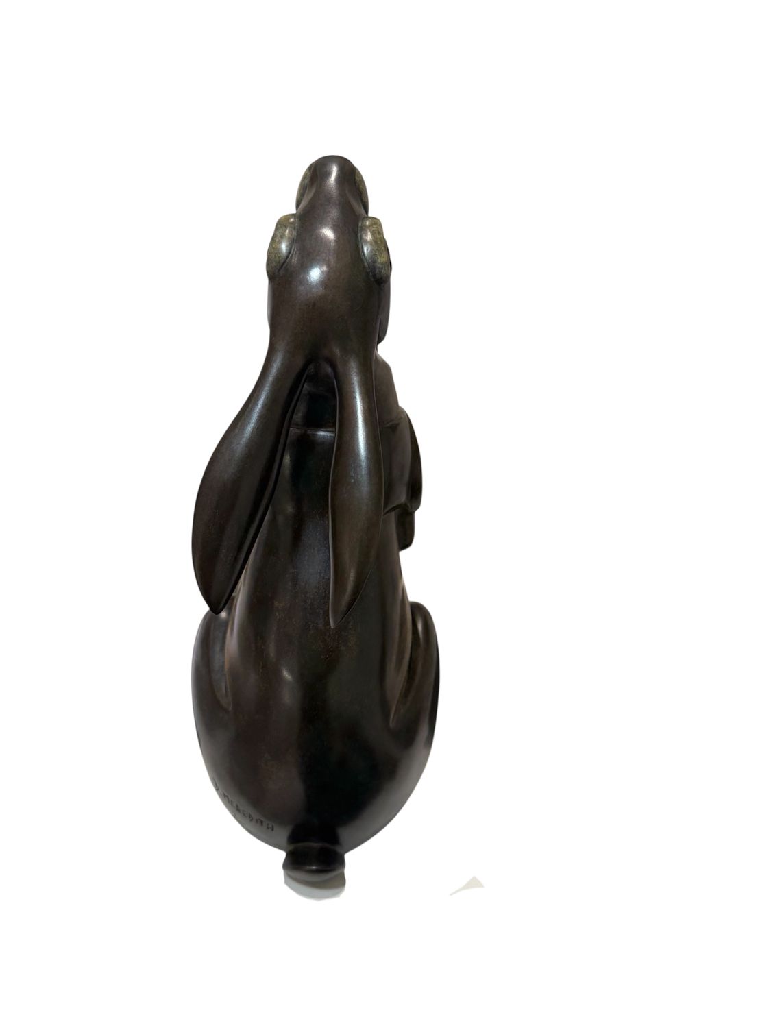 Bronze sculpture of a rabbit on a white background