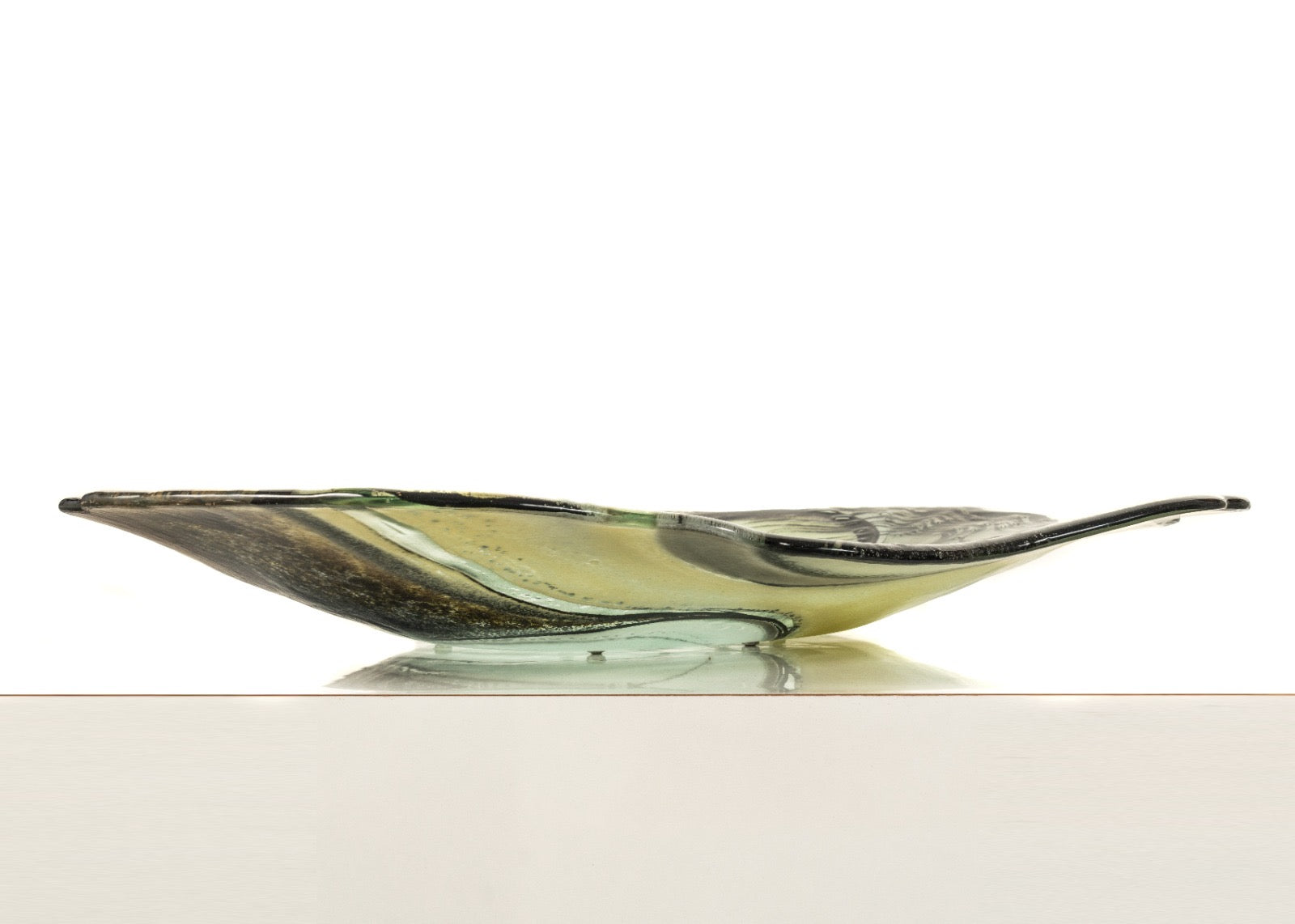 Glass bowl with wavy design on a white background