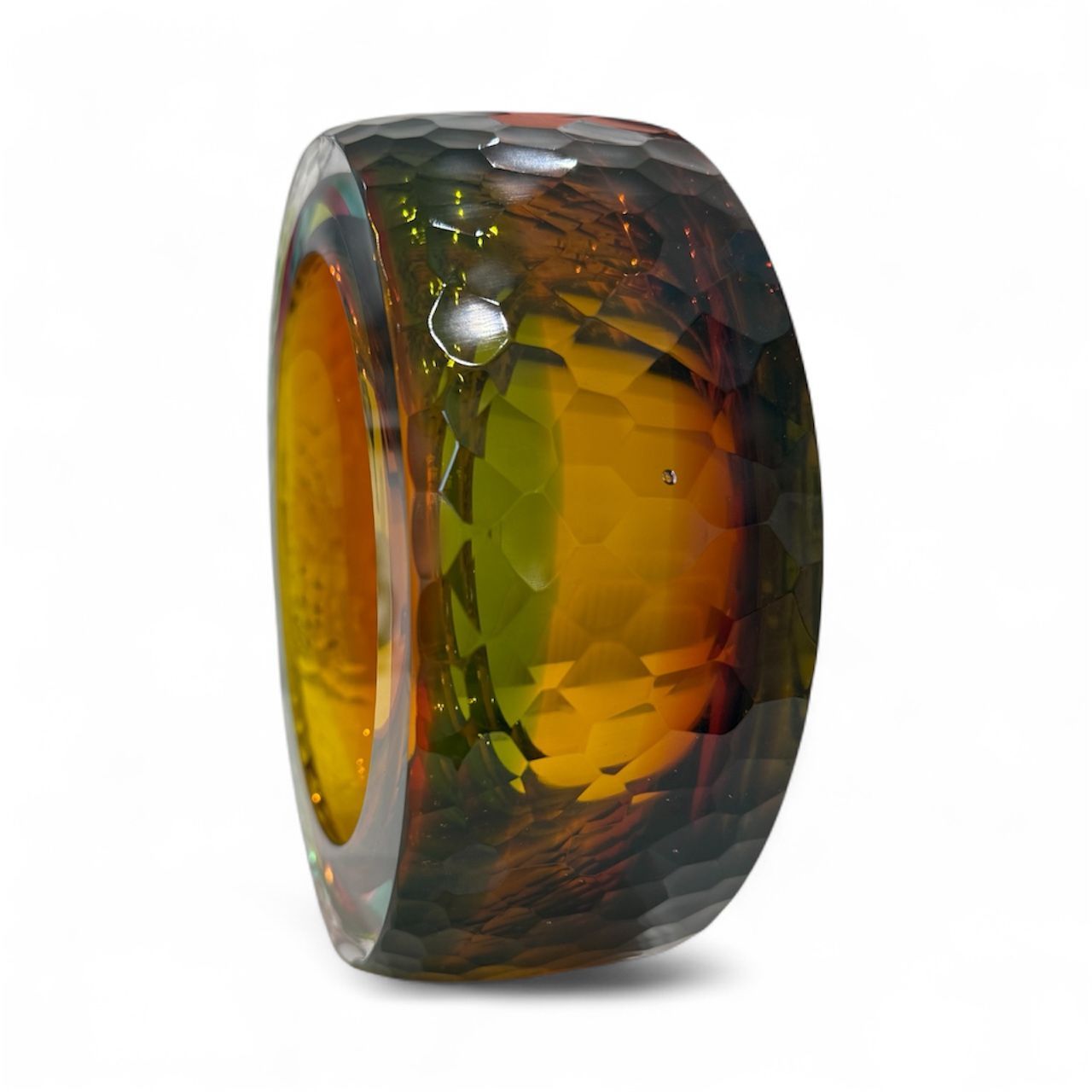 Multicolored ring with a textured surface on a white background