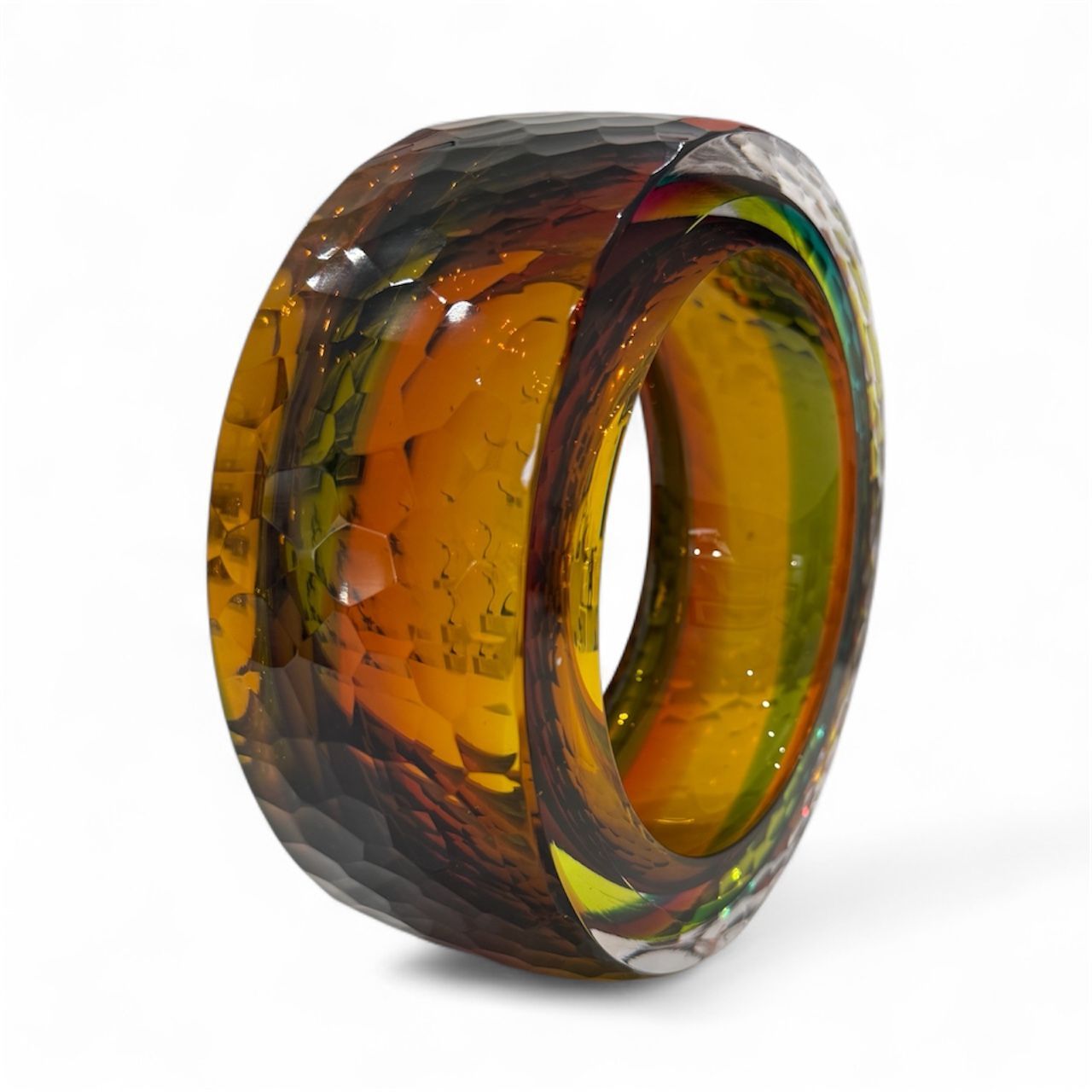 Multicolored ring with a textured surface on a white background