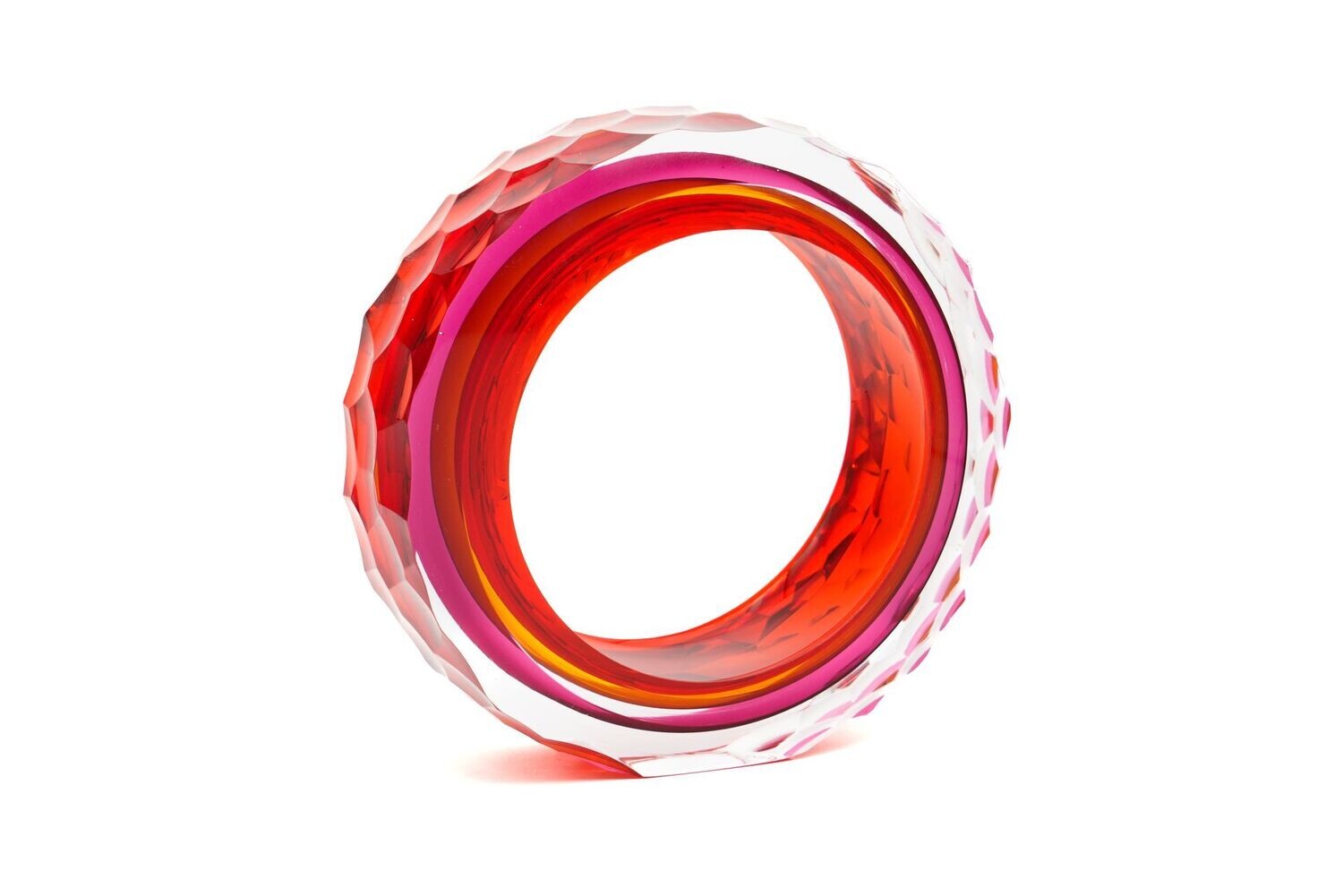 Red and pink geometric ring on a white background