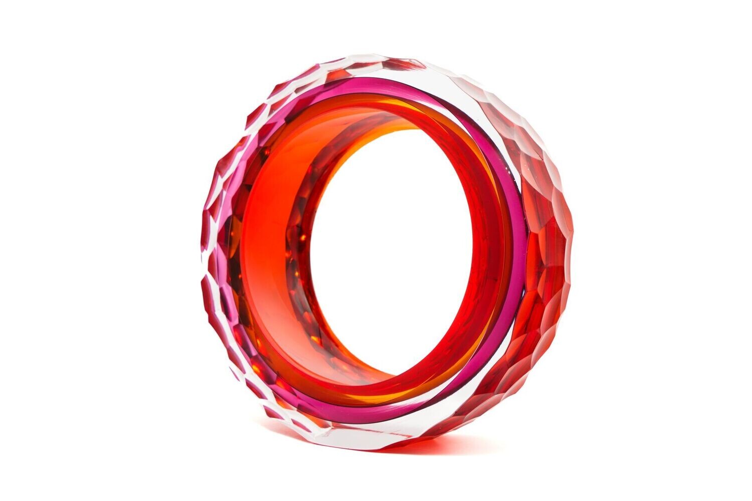 Red and pink geometric ring on a white background