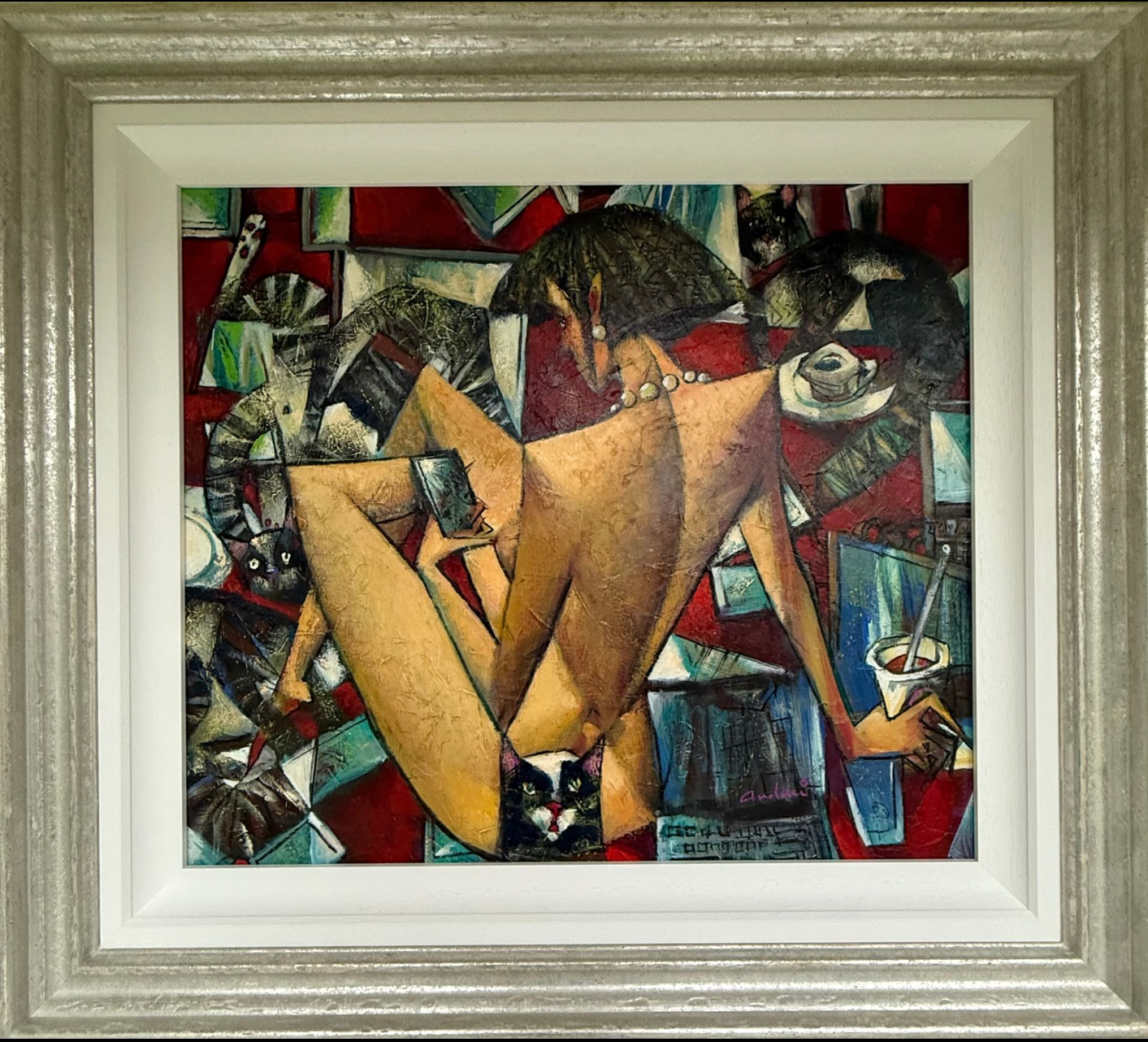 Framed abstract artwork with a central figure and colorful background
