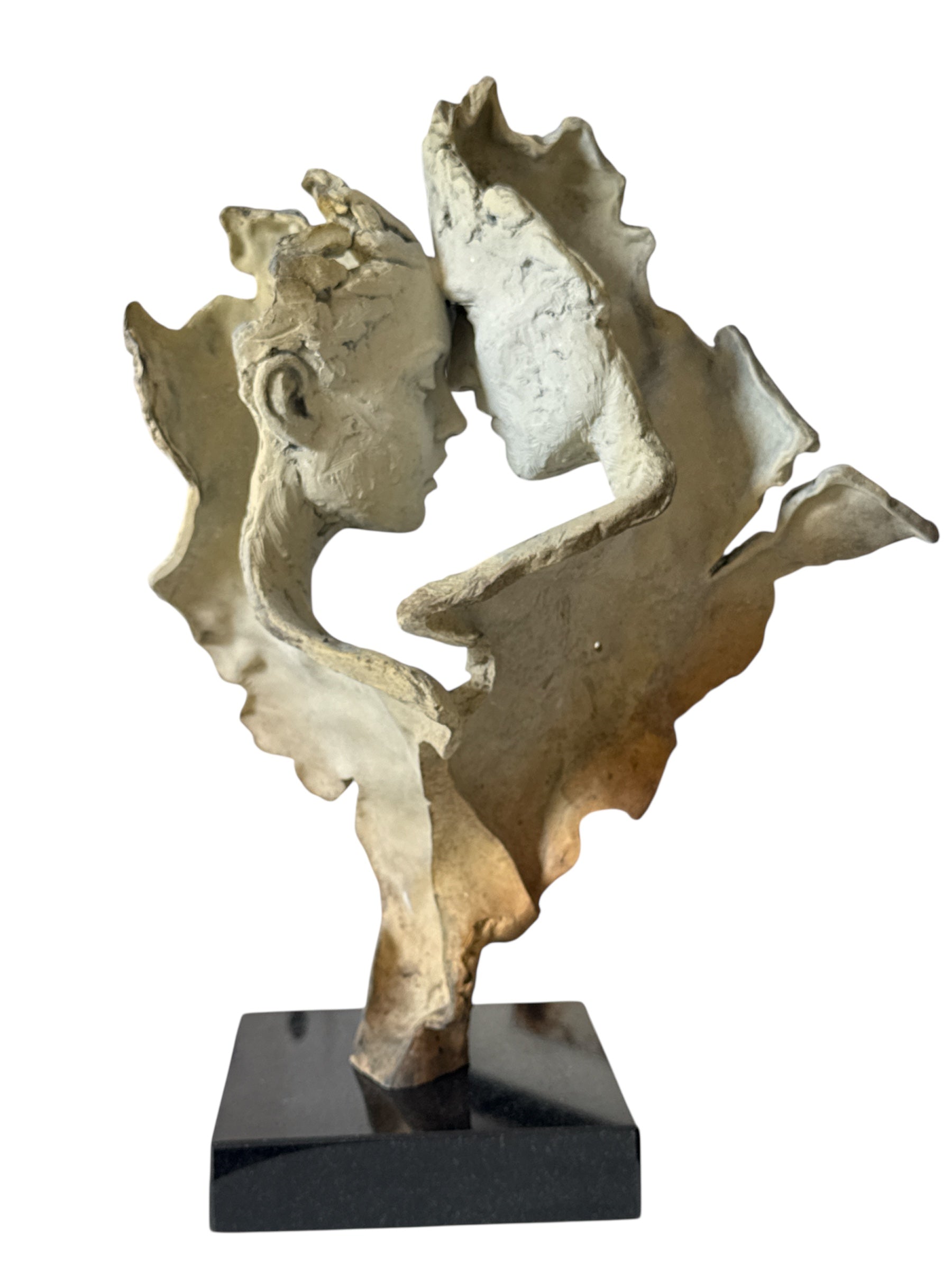 Abstract sculpture of a face on a white background