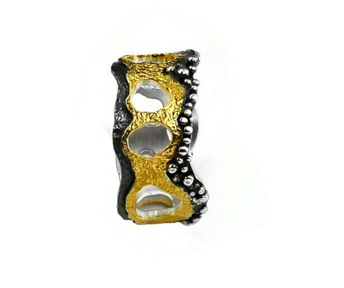 Gold and black knuckle duster on a white background