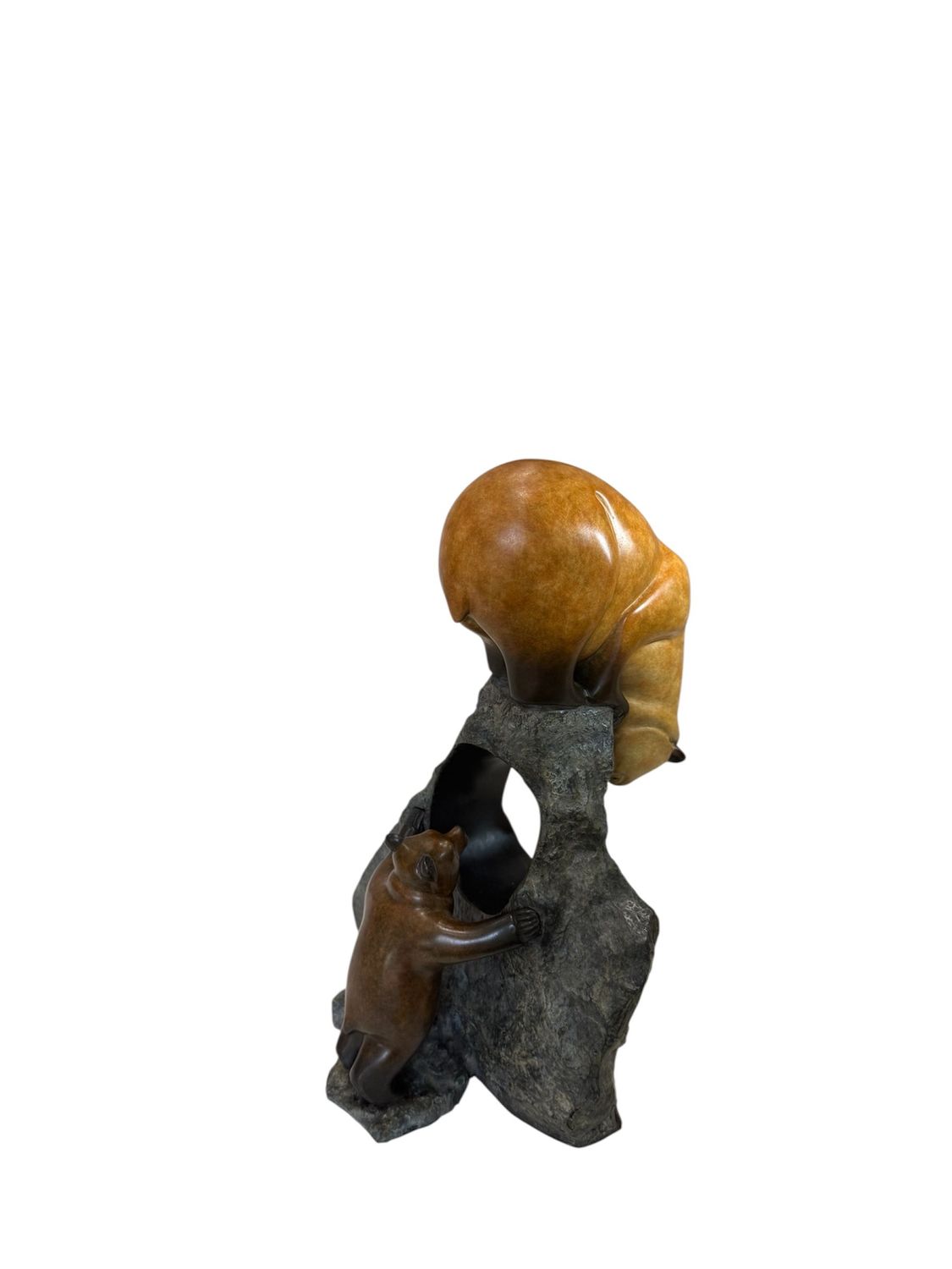 Decorative sculpture of a cub and bear on a rock with a white background