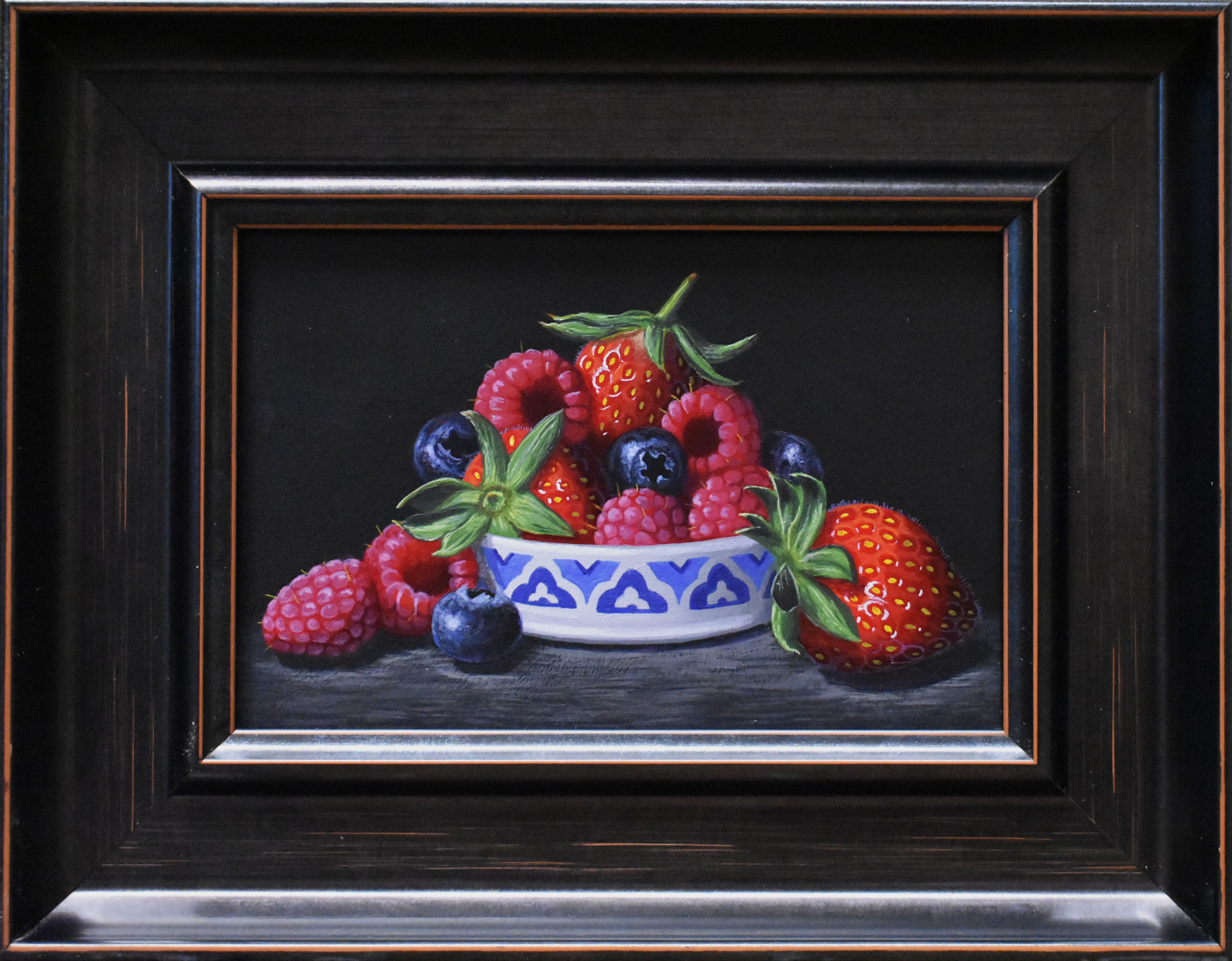 Framed still life painting of berries with a dark background