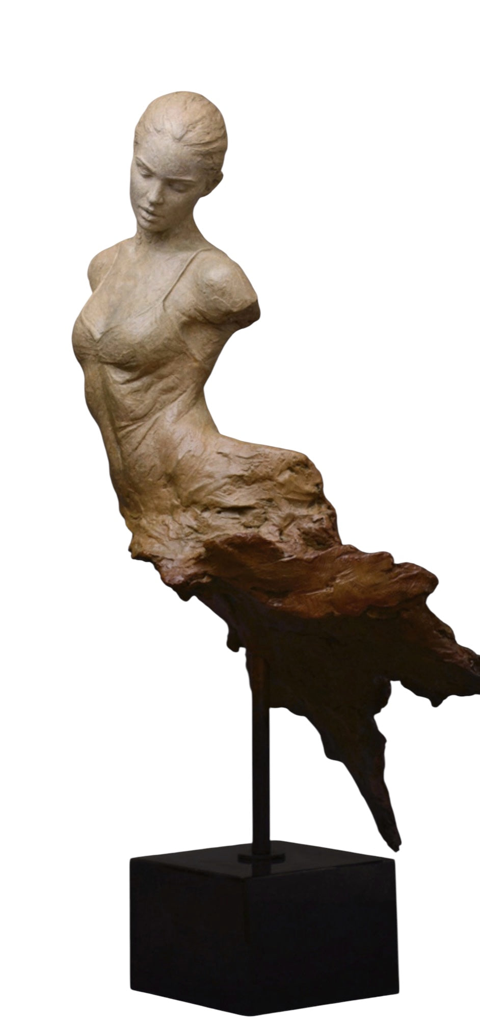 Statue of a woman sitting on a rock on a white background