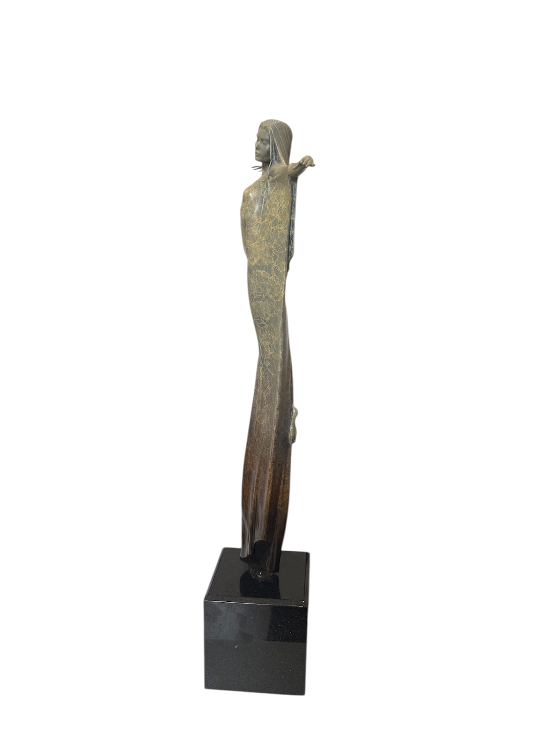bronze figure from the side on a black marble plynth