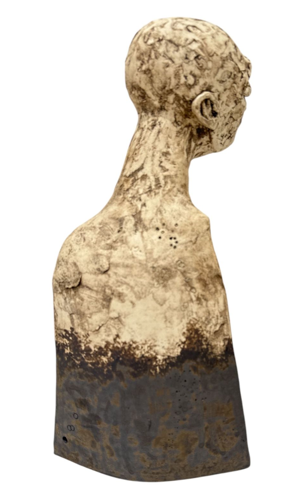 ceramic bust of a human figure on a white background