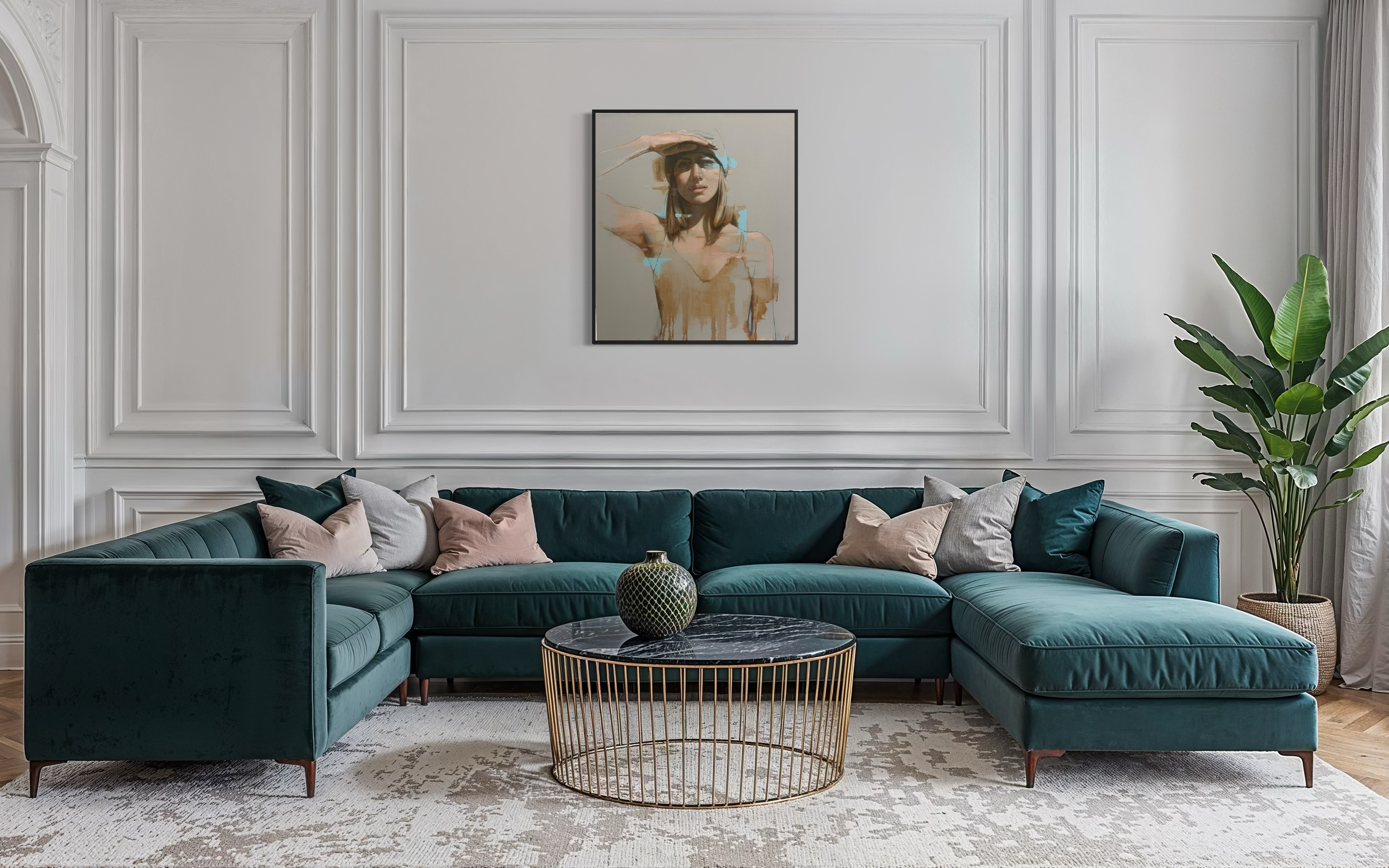 Modern living room with a teal sectional sofa, gold coffee table, and decorative elements.