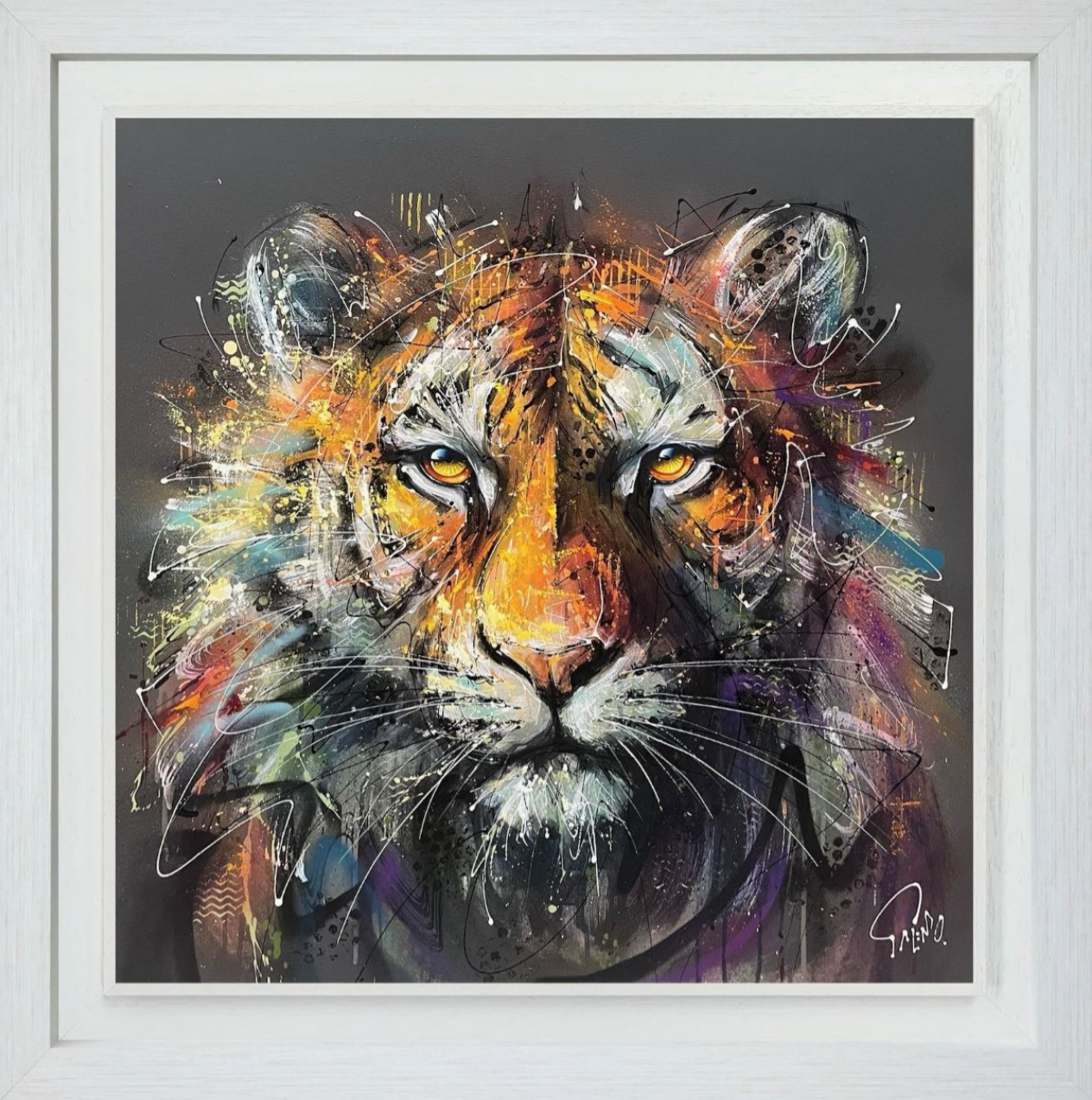 Framed abstract painting of a tiger's face with vibrant colors on a dark background