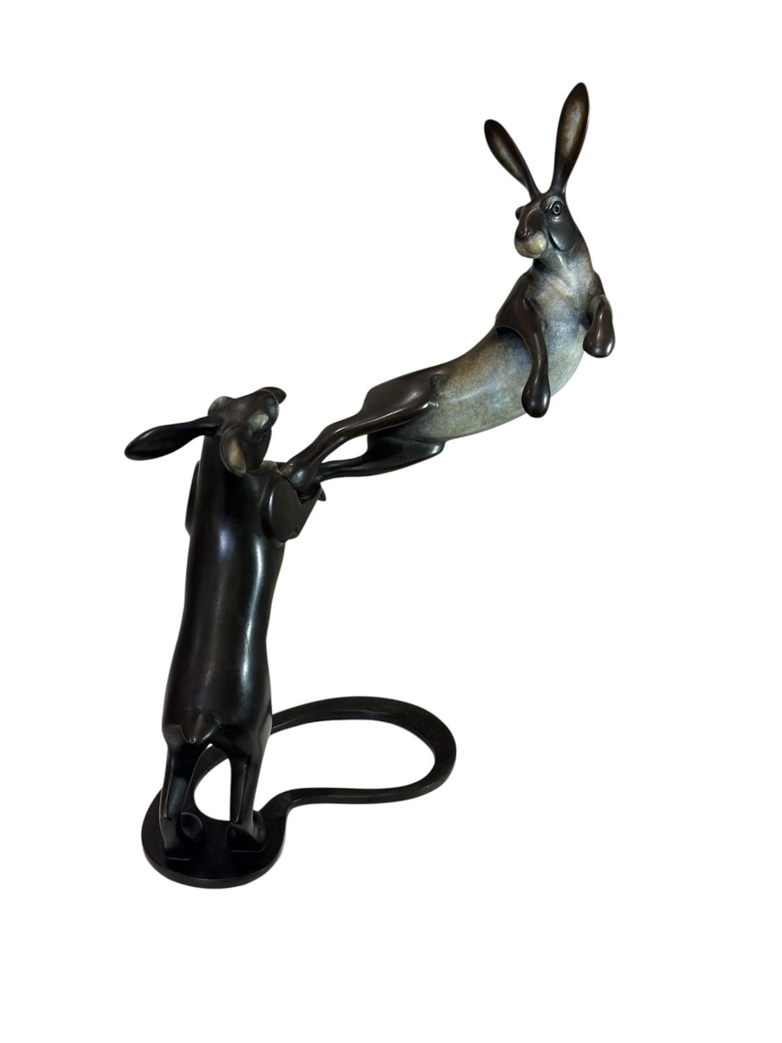Bronze sculpture of a hare on a white background