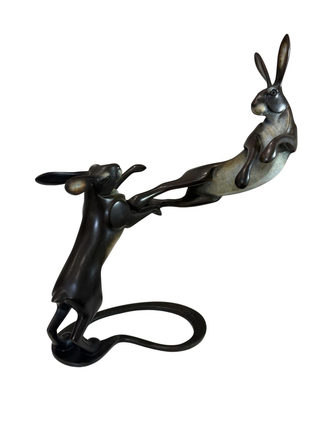 Bronze sculpture of a hare on a white background