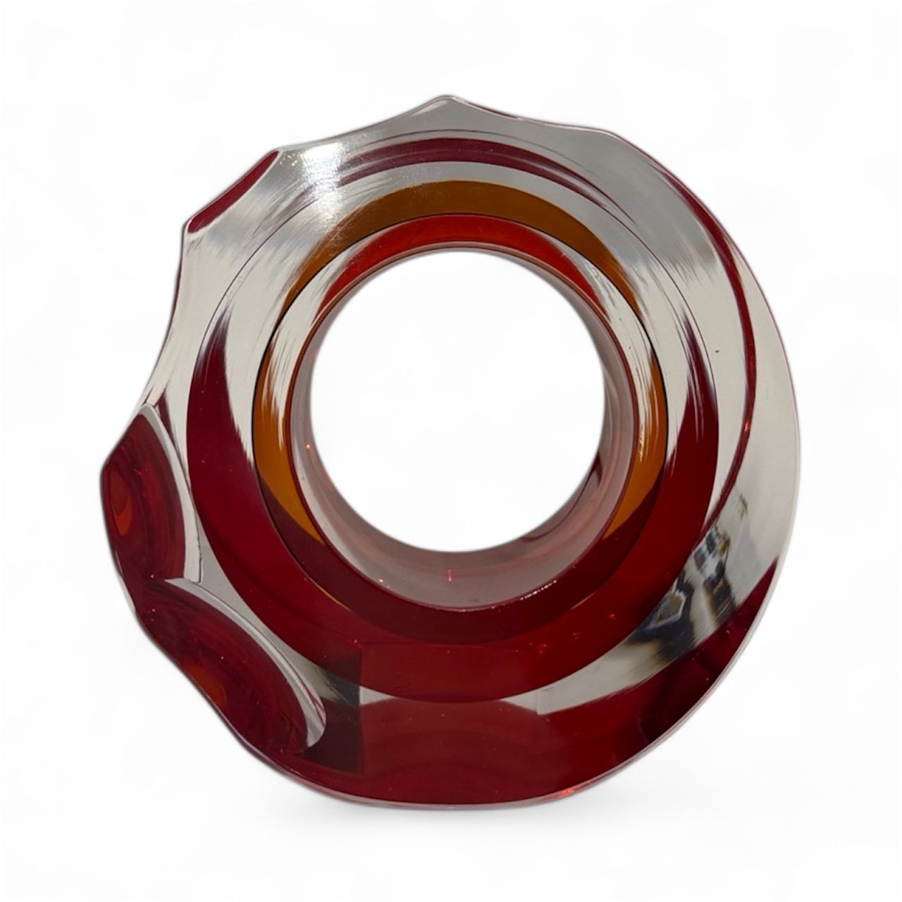 Red and silver metallic object on a white background