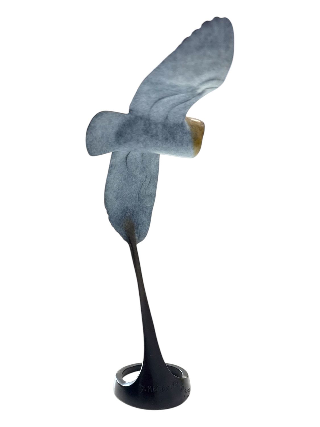 Decorative sculpture of a bird with outstretched wings on a white background