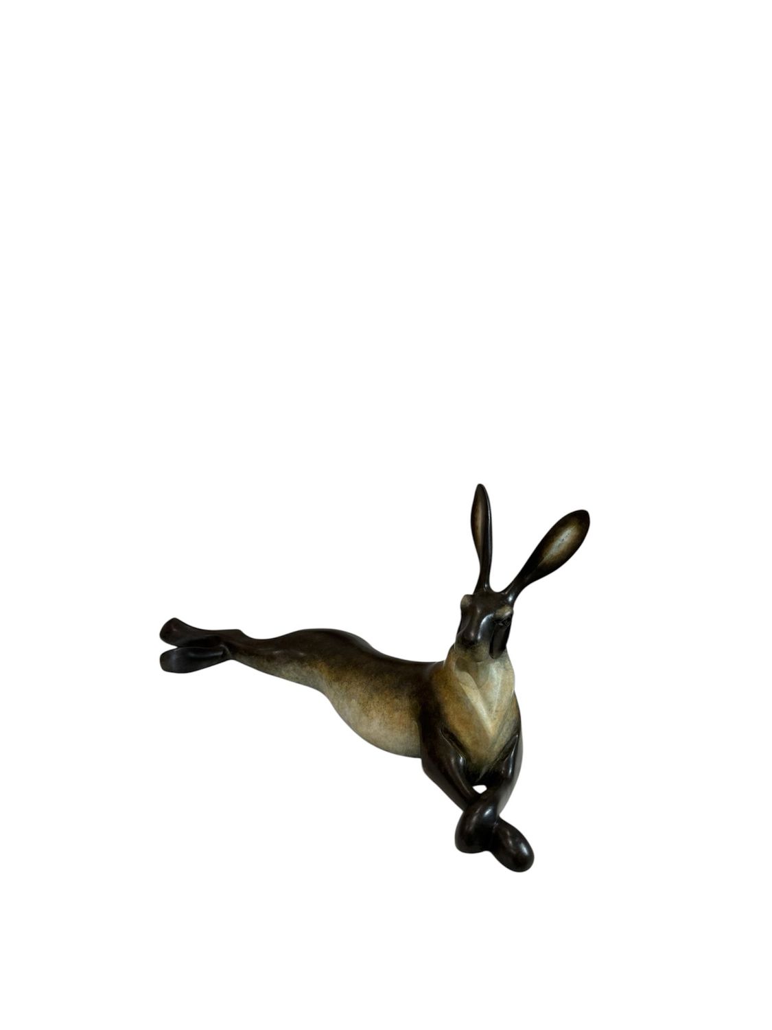 Decorative figurine of a lying hare on a white background