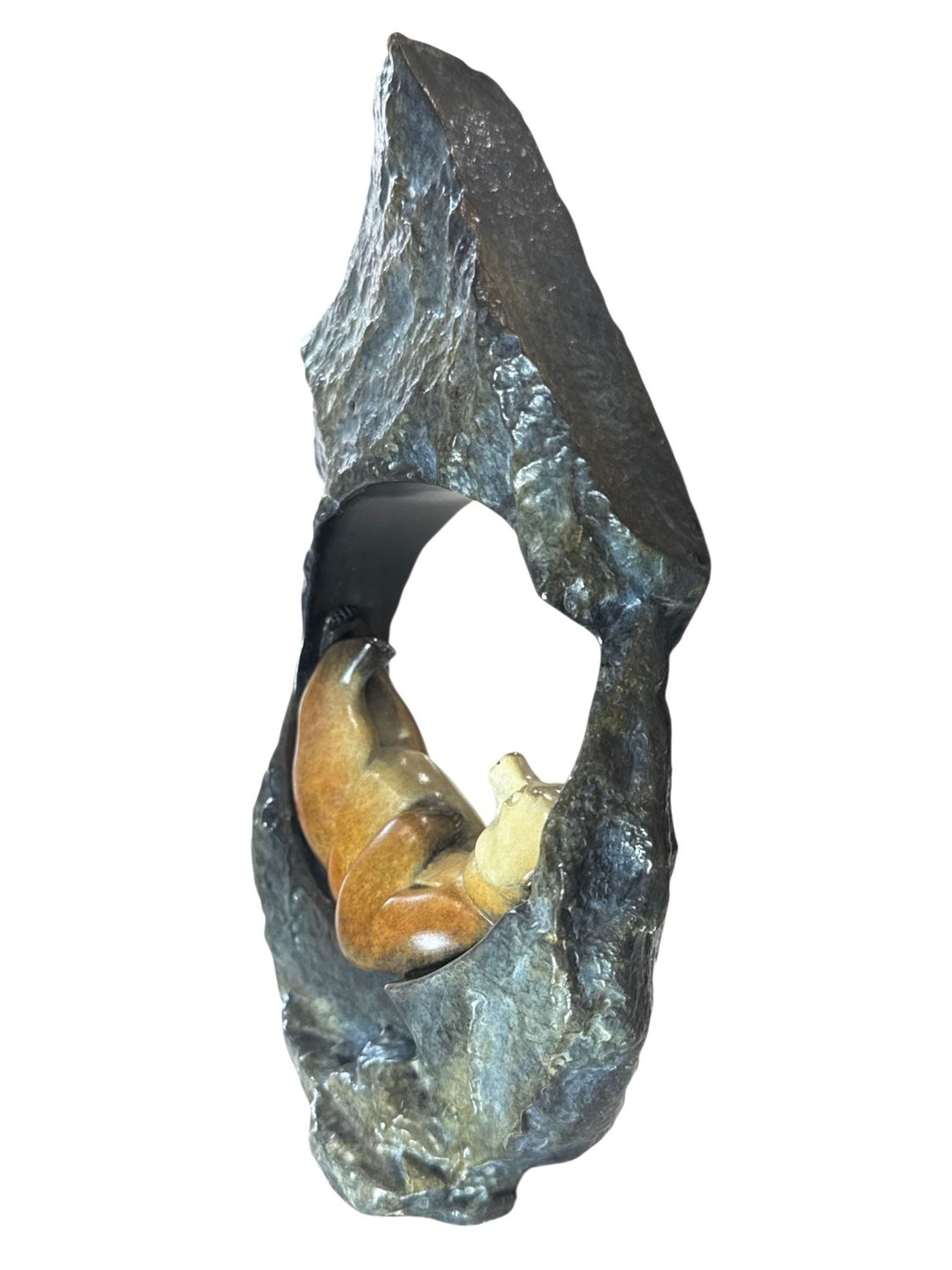 Decorative sculpture of a bear emerging from a rock on a white background