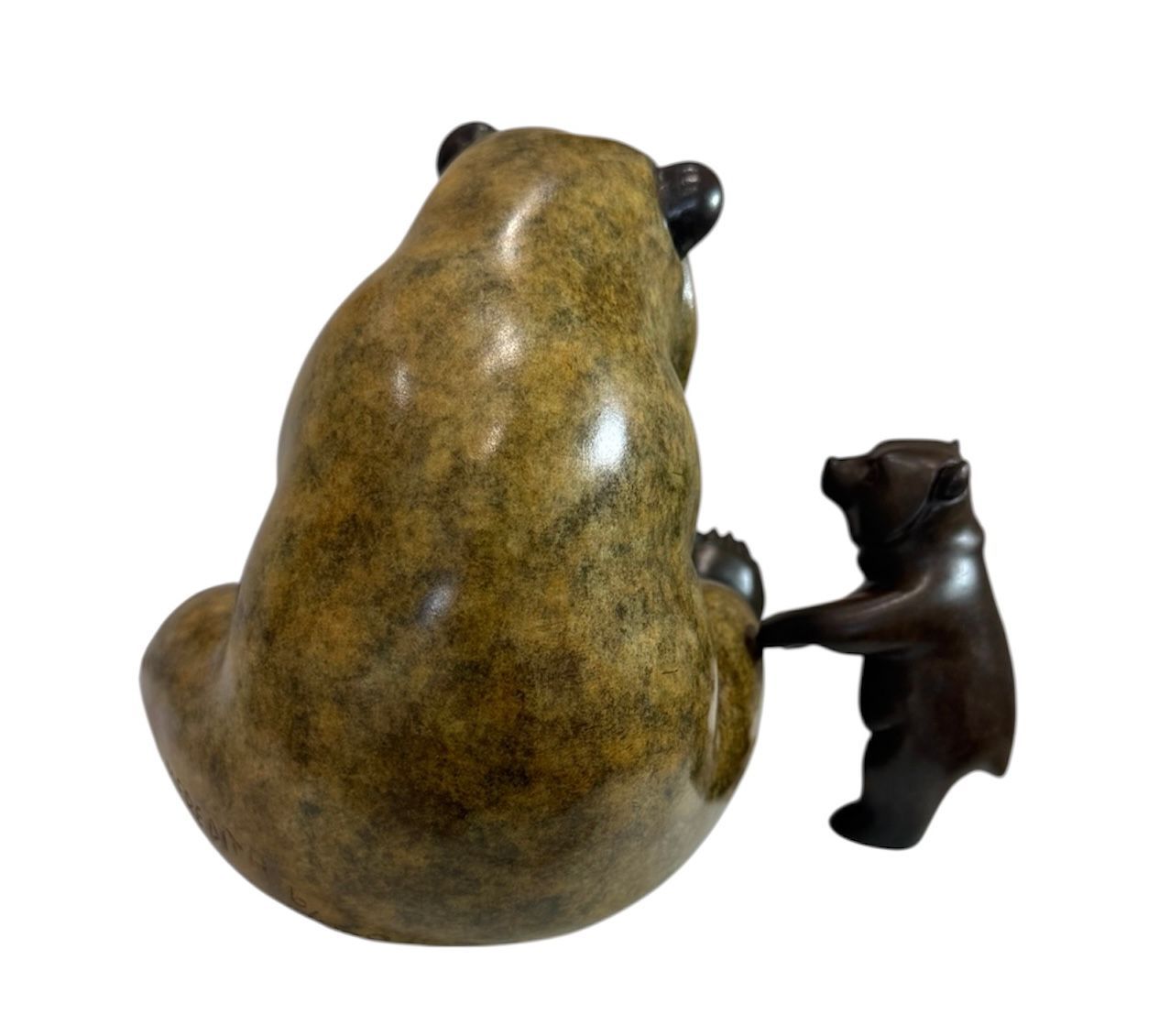 Bronze sculpture of a bear and a cub on a white background