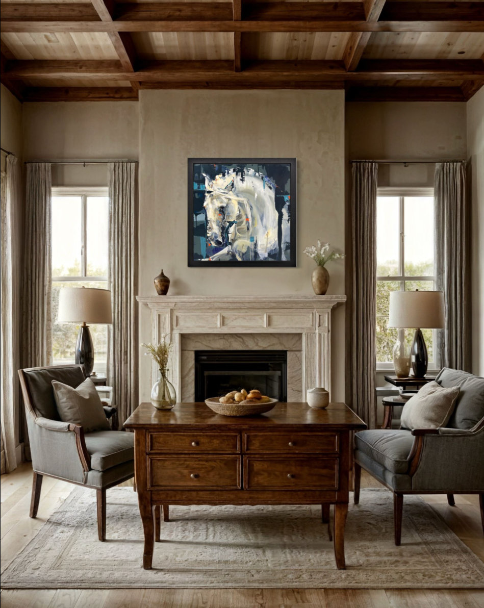Living room with wooden coffee table, gray chairs, and fireplace with lyndsey selley original painting.