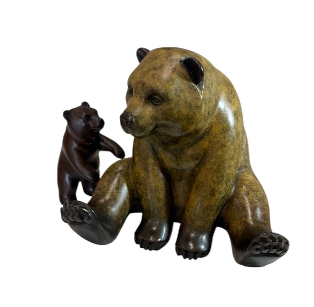Bronze sculpture of a bear and cub on a white background
