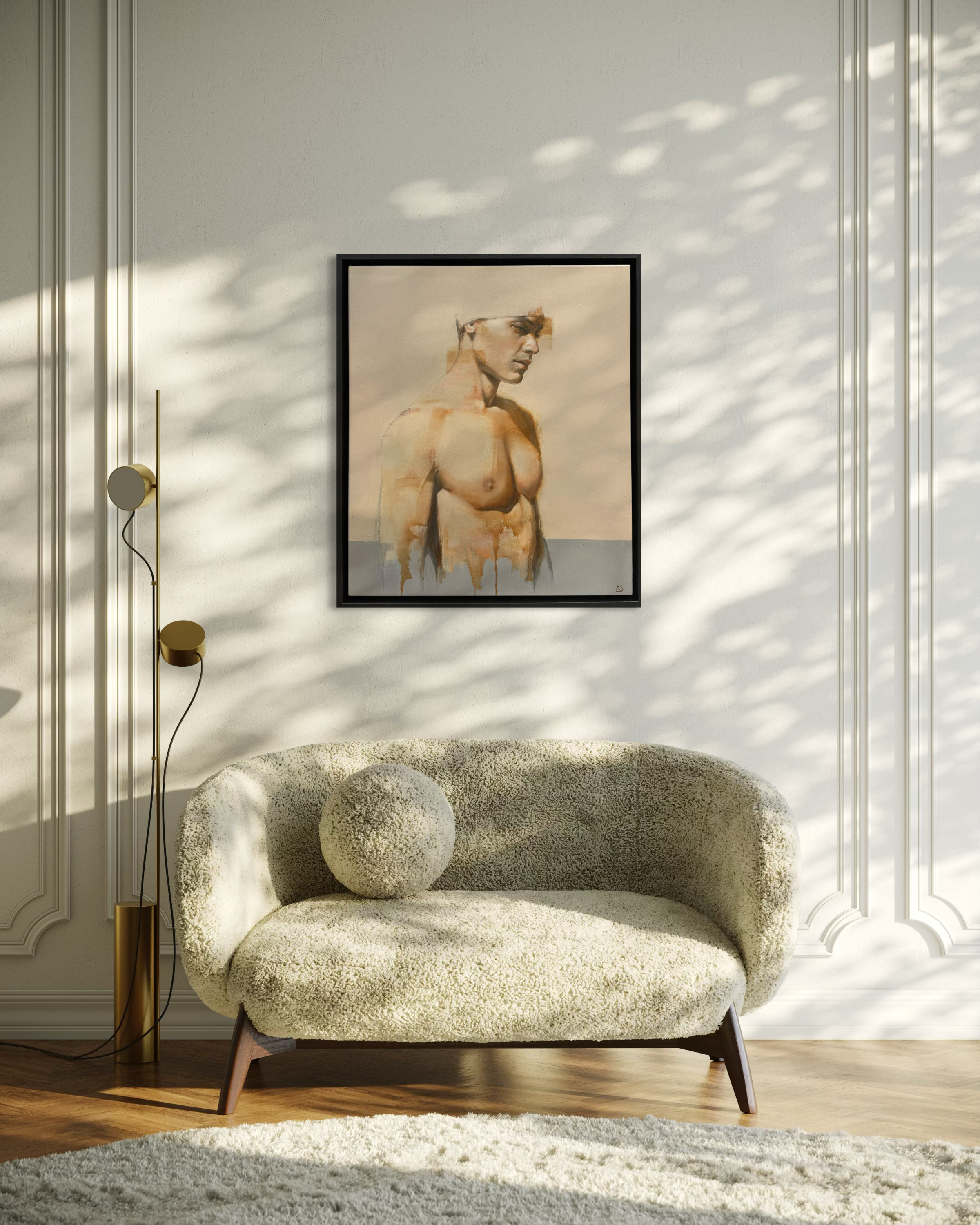 Modern living room with a patterned sofa, floor lamp, and framed artwork on the wall.