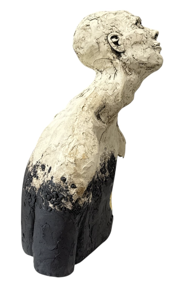 Statue of a woman with a white and black finish on a white background