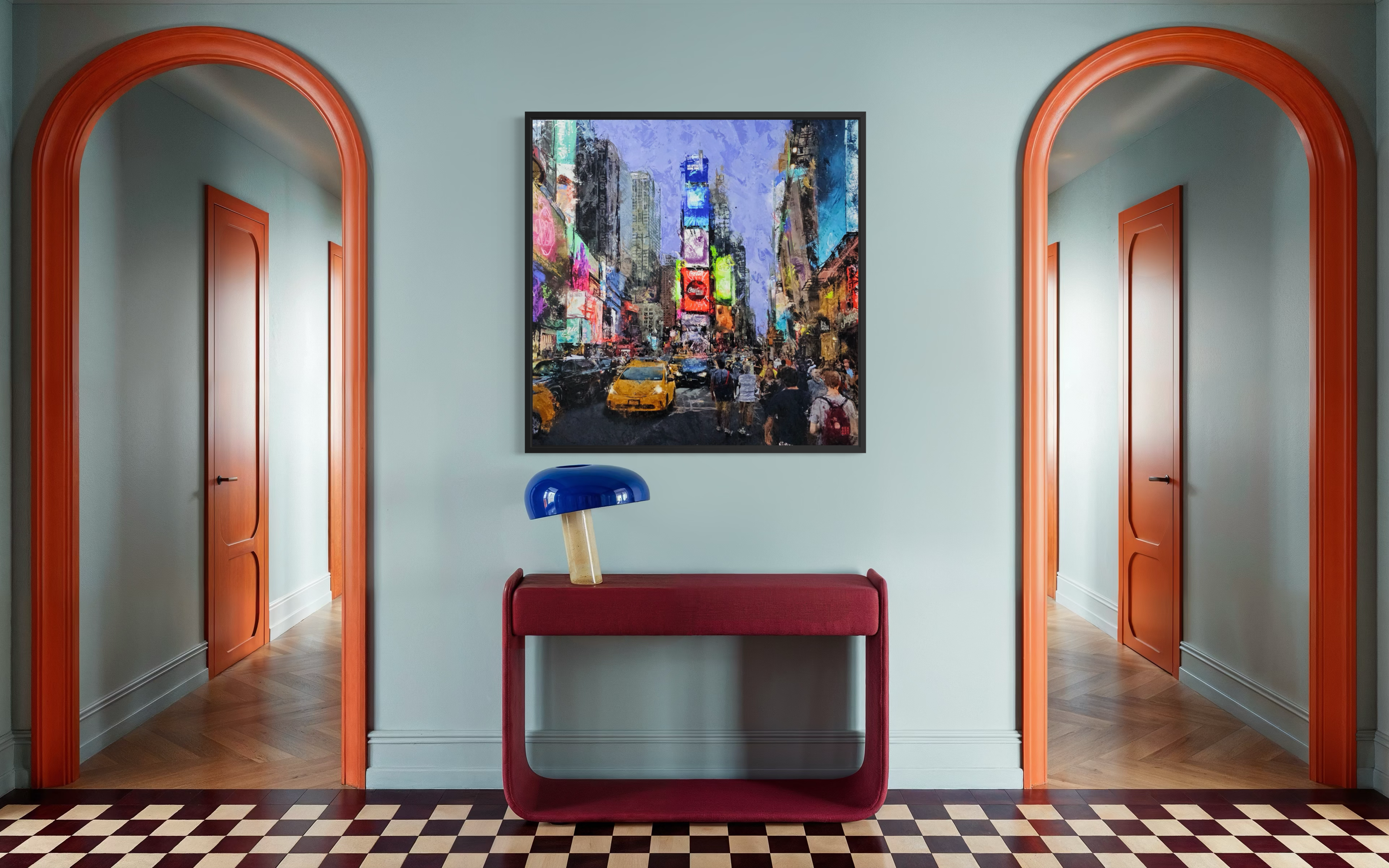Colorful NYC times square painting above a red bench in a room with arched doorways.