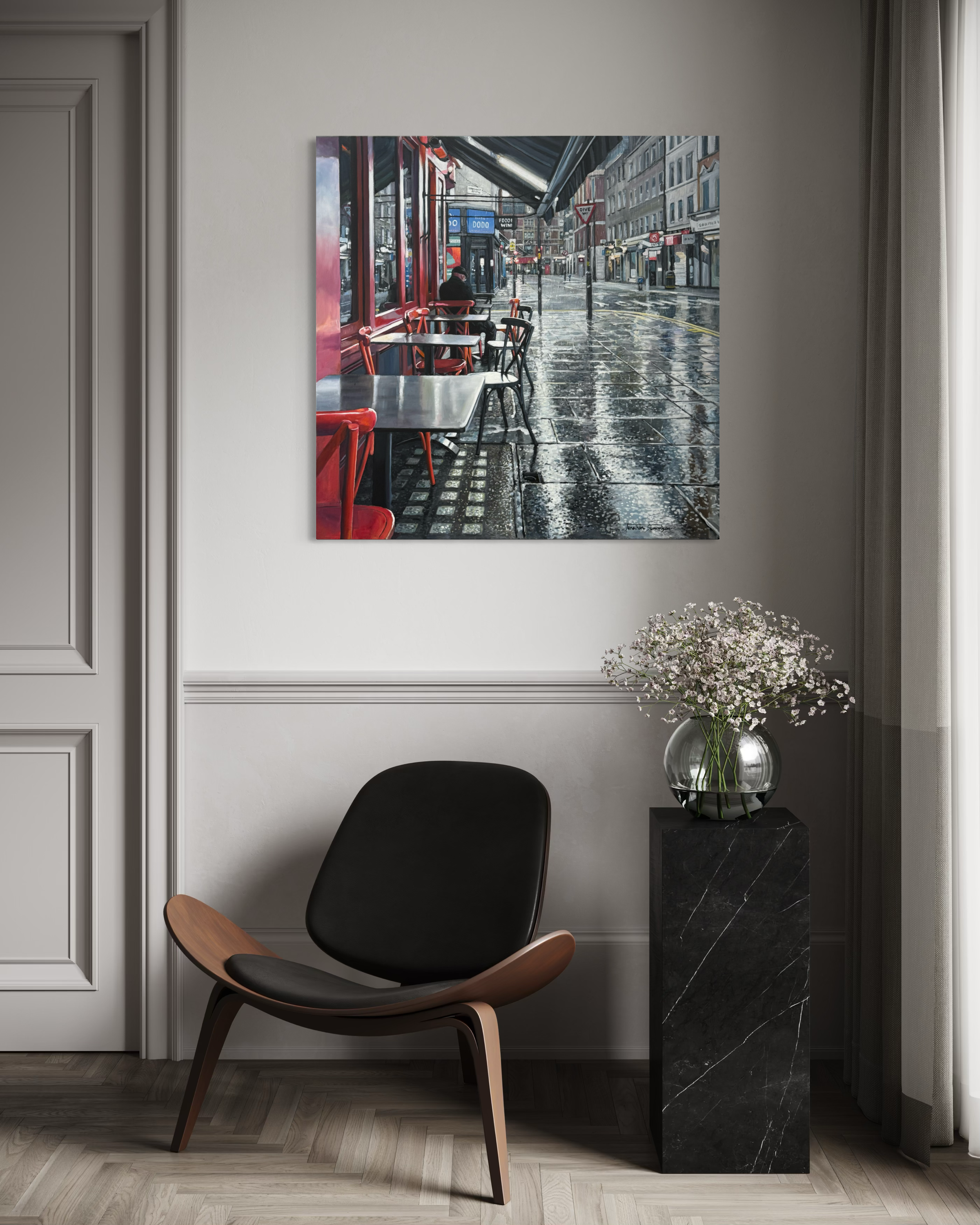 Modern interior hallway showing contemporary city oil painting of Soho London a red restaurant bar front with rain reflections on the pavement and a solitary figure sat waiting under an awning at a table and chairs
