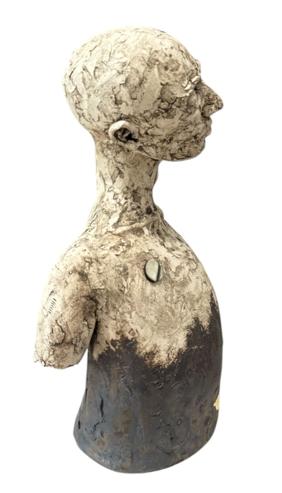 Abstract sculpture of a human figure on a white background