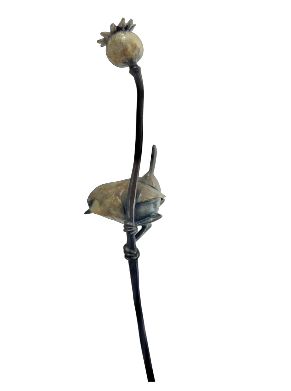 bronze flower with a resting wren on a white background
