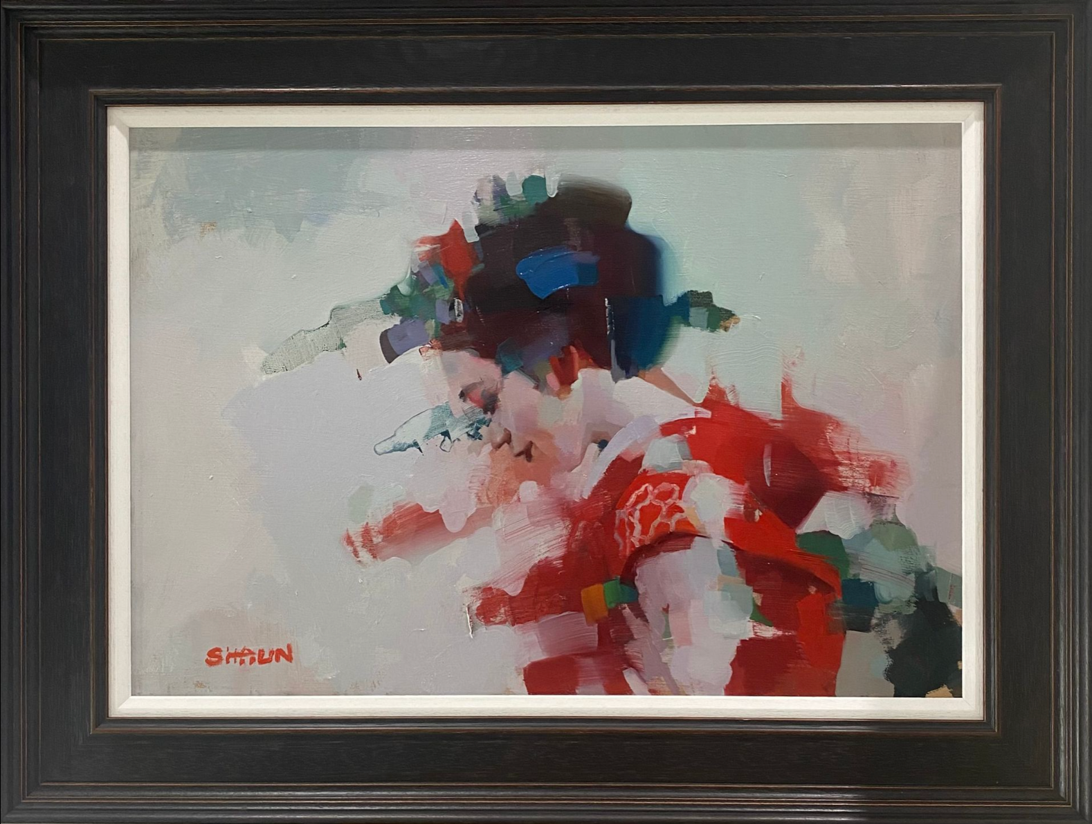 Abstract painting of a geisha with vibrant colours in a black frame